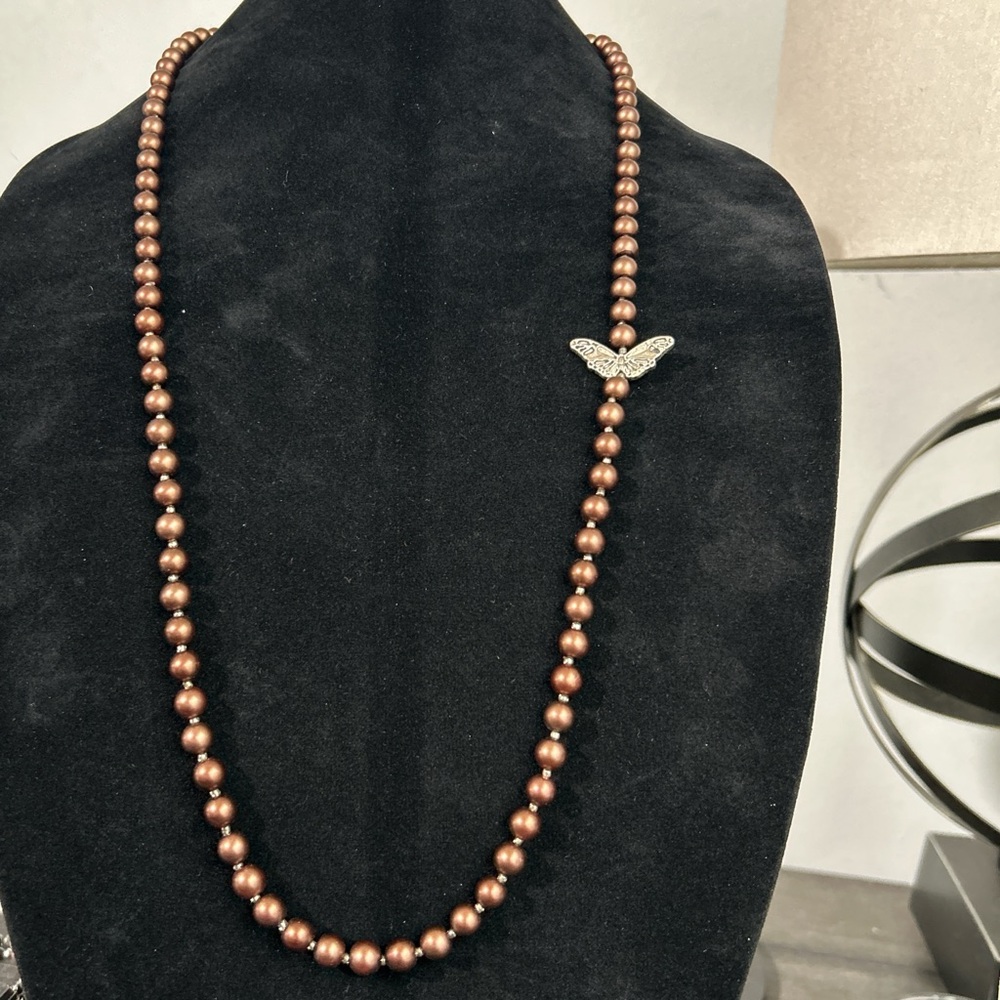 Elegant Brown Beaded Necklace with Butterfly Accent